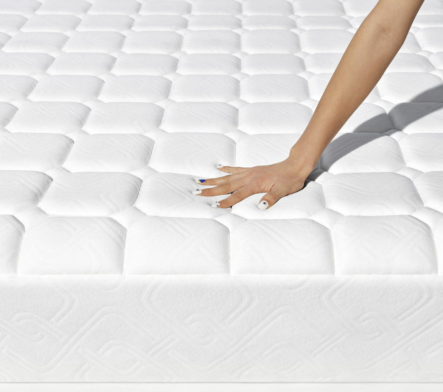 Hybrid - hand pressing on mattress